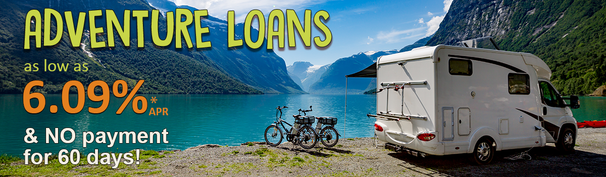 RV and bikes by mountains